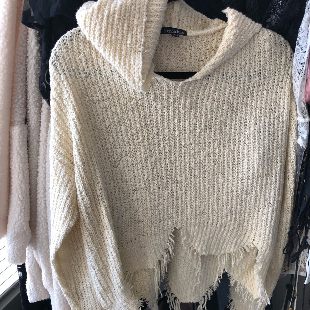 Distressed cream sweater